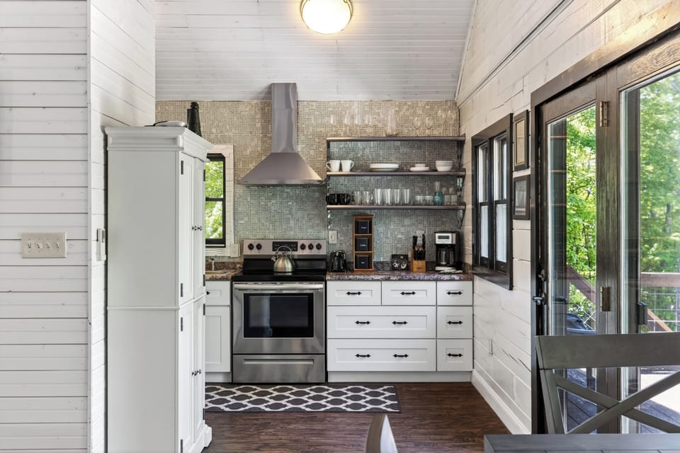 A modern, fully-equipped kitchen featuring stainless steel appliances and ample cabinetry.