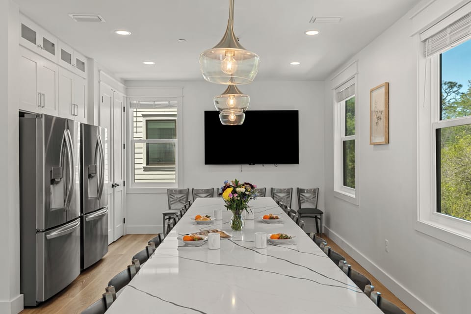 Formal dining area with television, perfect for large groups or families (Grayton Dreams)