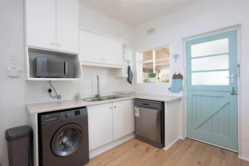 Kitchen is equipped with a washing machine and dishwasher for your convenience. 
