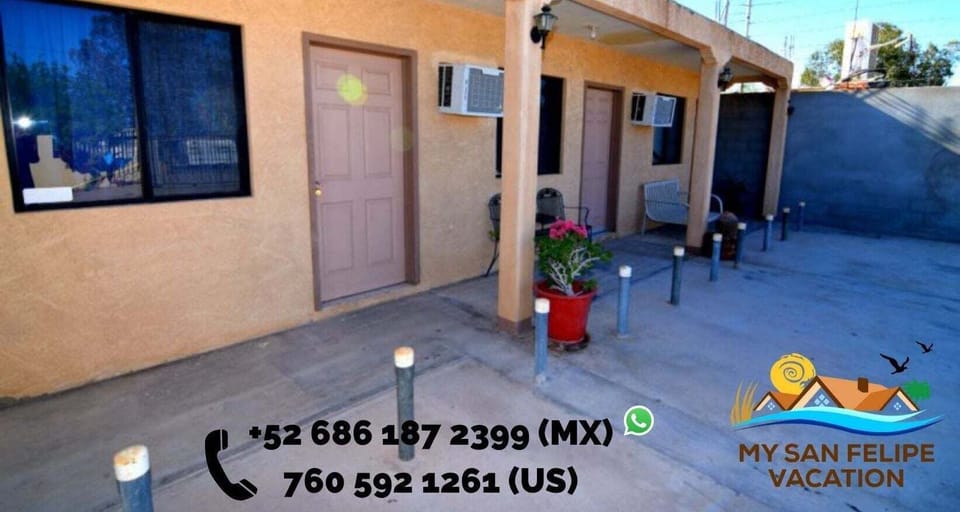 The clean front exterior of Beatrice Place 2 offers a private, ground-floor entrance with secure gated parking included, just minutes from the Malecón and beach.