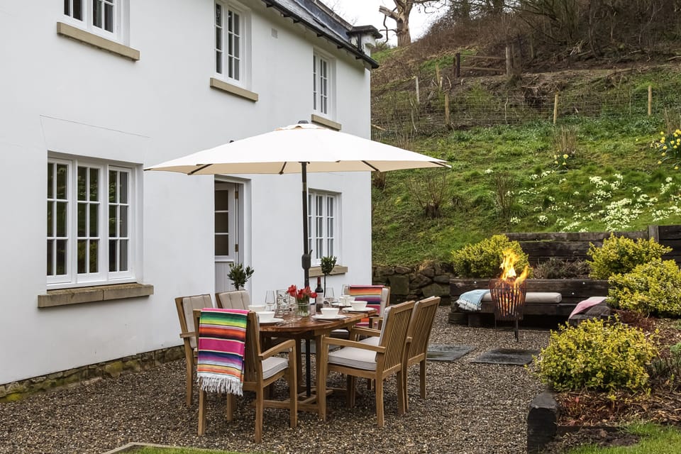 Enjoy an al fresco dinner outside with the warmth of the fire pit