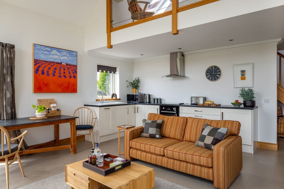Designed for easy living, this stylish open-plan space brings together cooking, dining, and relaxation in one inviting setting