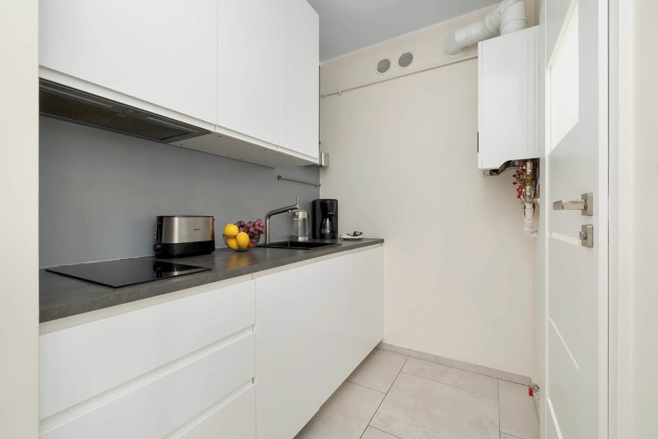 Fully equipped kitchenette with modern appliances and everything needed for a comfortable stay.