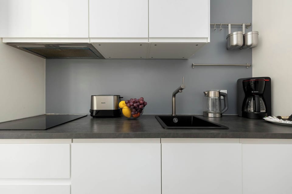Modern kitchenette with sleek design, equipped with all essentials for convenient everyday cooking.