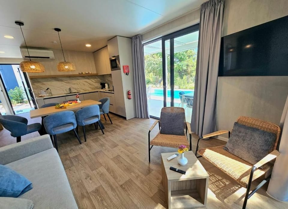 Exclusive Villa, 3 Bedrooms, Patio, Pool View | Living area | TV