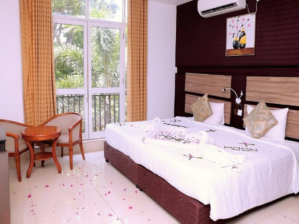 Deluxe Double Room, Balcony, Garden View | Laptop workspace, free WiFi
