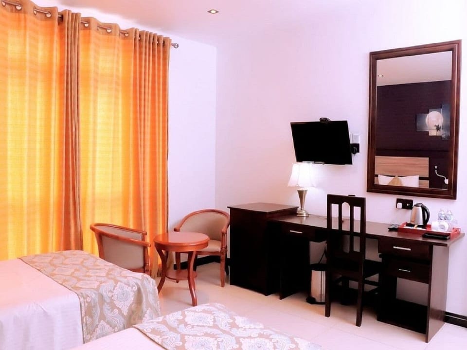 Deluxe Triple Room, Balcony, Garden View | Laptop workspace, free WiFi