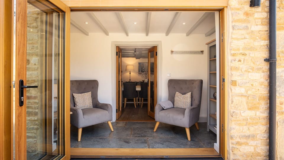Large bi-fold doors can be opened to provide direct access to the garden.