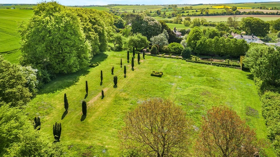 Outside, the breathtaking gardens are a true highlight of this property.