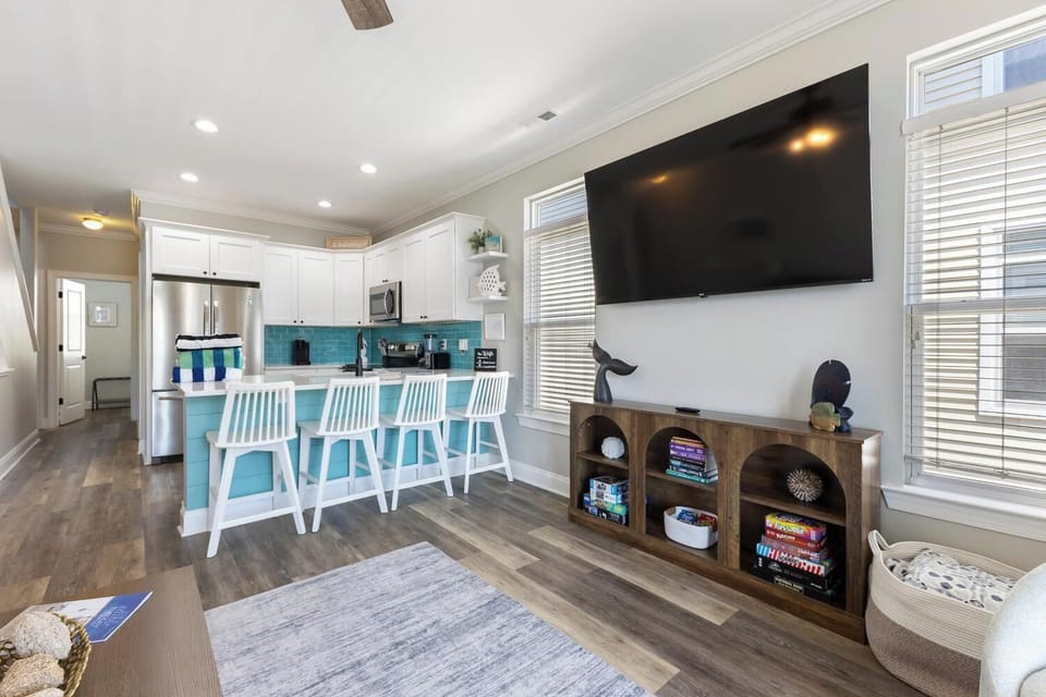 Relax in your bright open-concept living space with a fully equipped kitchen, cozy seating, and large-screen entertainment—perfect for unwinding after a day of adventure.