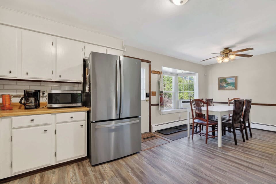 Your fully equipped kitchen flows into the dining area, perfect for home-cooked meals together.