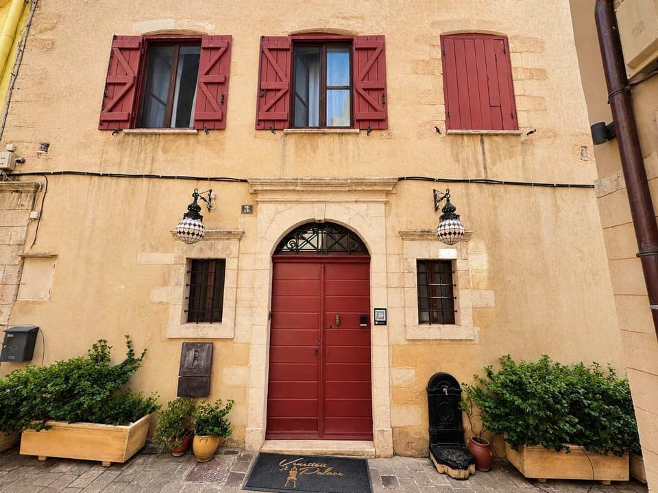 Traditional stone façade located in a charming alley of Chania’s historic center