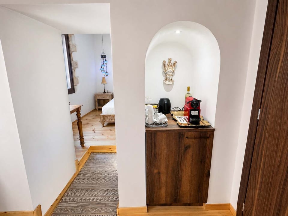Coffee corner with machine, kettle, and essentials provided for added comfort