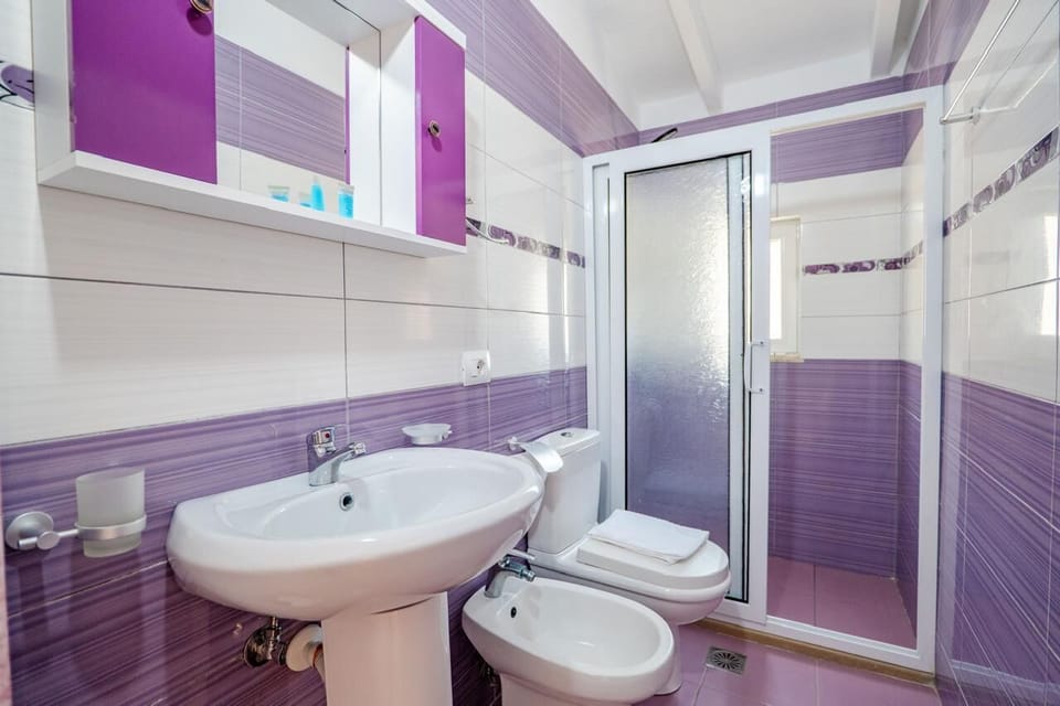 Deluxe Double Room, Balcony, Sea View | Bathroom | Shower, free toiletries, towels, soap