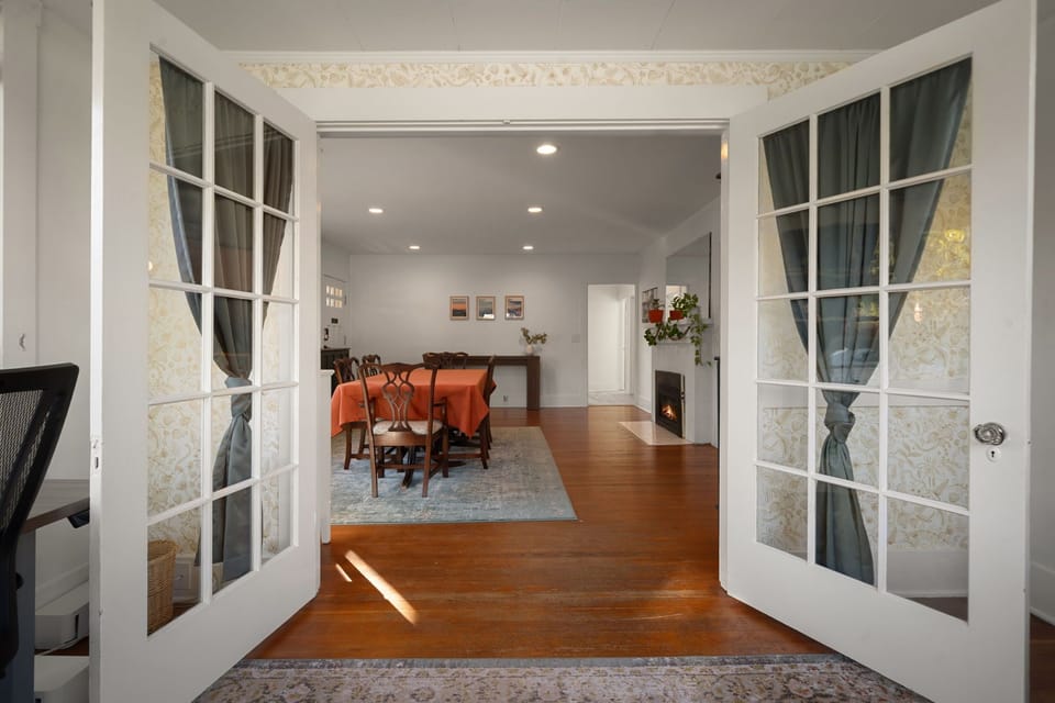 Classic French doors open into the dining area.