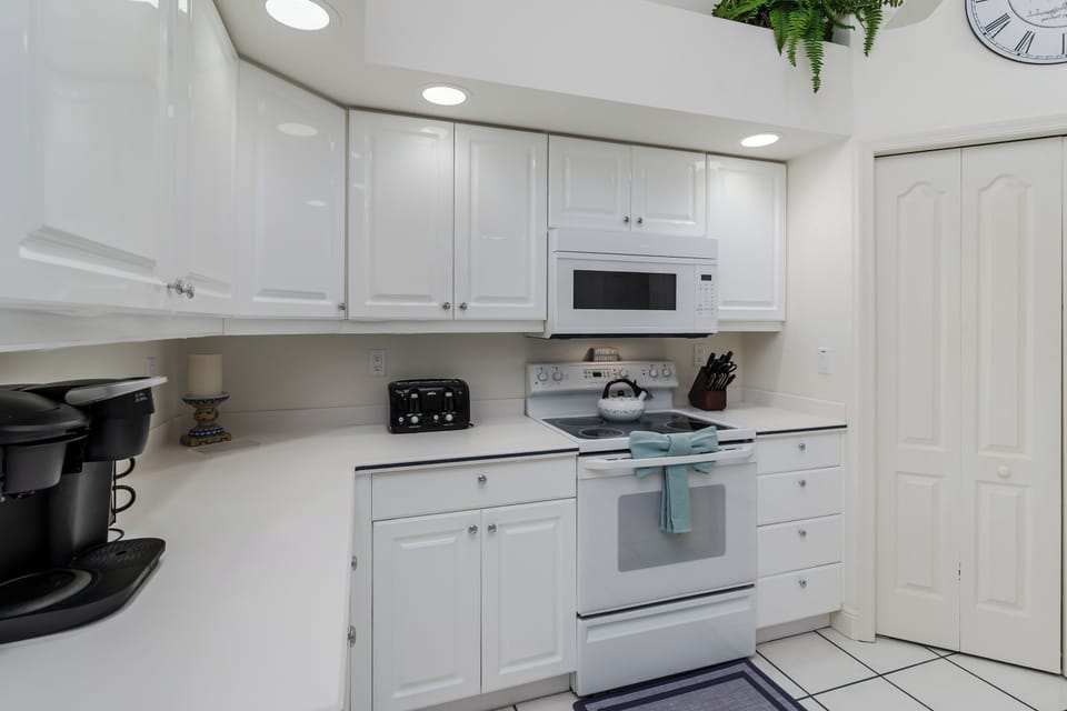This bright, fully equipped kitchen has everything you need to cook up a storm during your stay, from morning coffee to home-cooked meals.