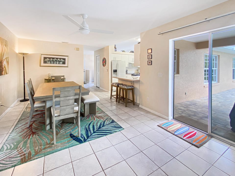 Open dining area with patio access, perfect for indoor-outdoor meals.