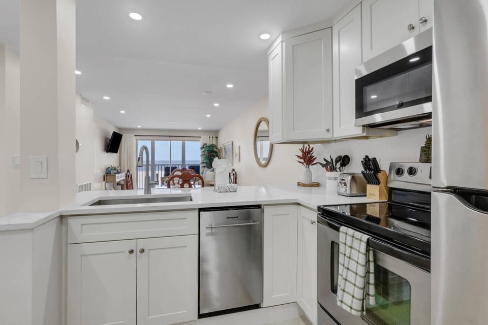 The open kitchen allows conversation to flow freely throughout the kitchen and dining/living space.