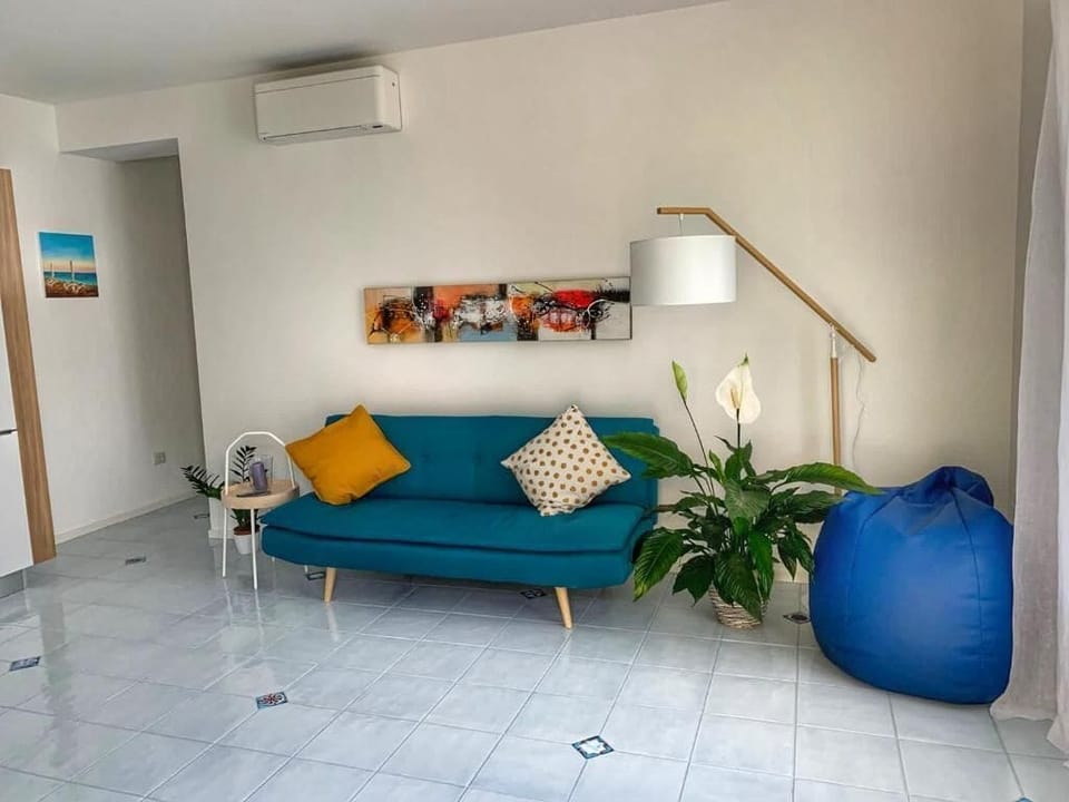 Apartment, Sea View | Living area | 20-inch Smart TV with satellite channels
