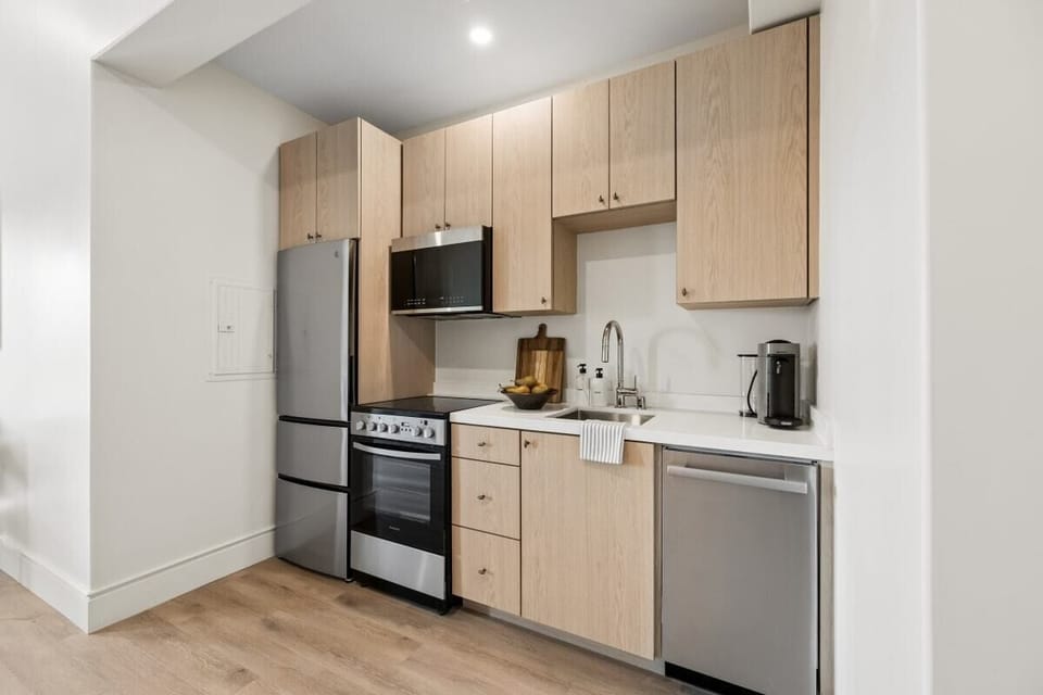 Full kitchen: Nespresso, fridge, stove/oven, plates and utensils, dishwasher