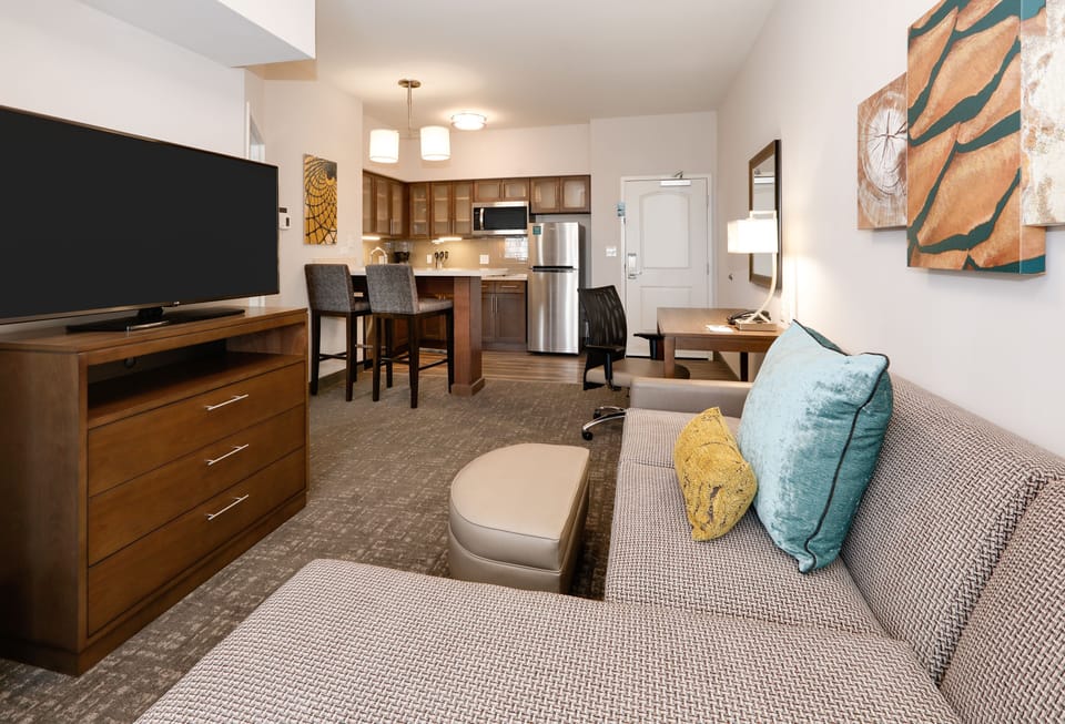 Open-plan living space with comfortable furnishings and modern decor.