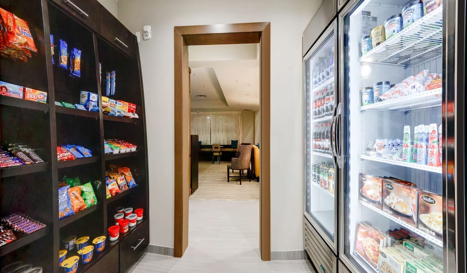 Convenient grab-and-go pantry stocked with snacks and beverages 24/7.