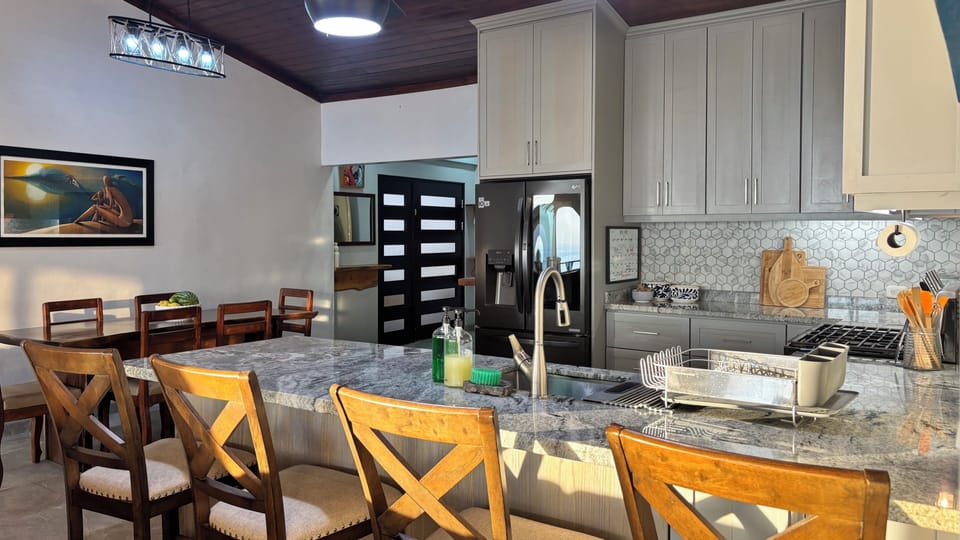 Gas stove, refrigerator with dual ice maker, and granite counter tops.