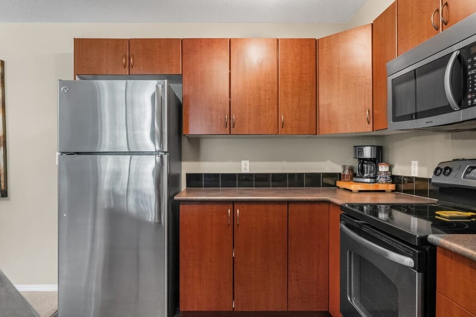 Full kitchen with a drip coffee machine, ground coffee, tea, sugar and basic condiments (ketchup, mustard and relish.)