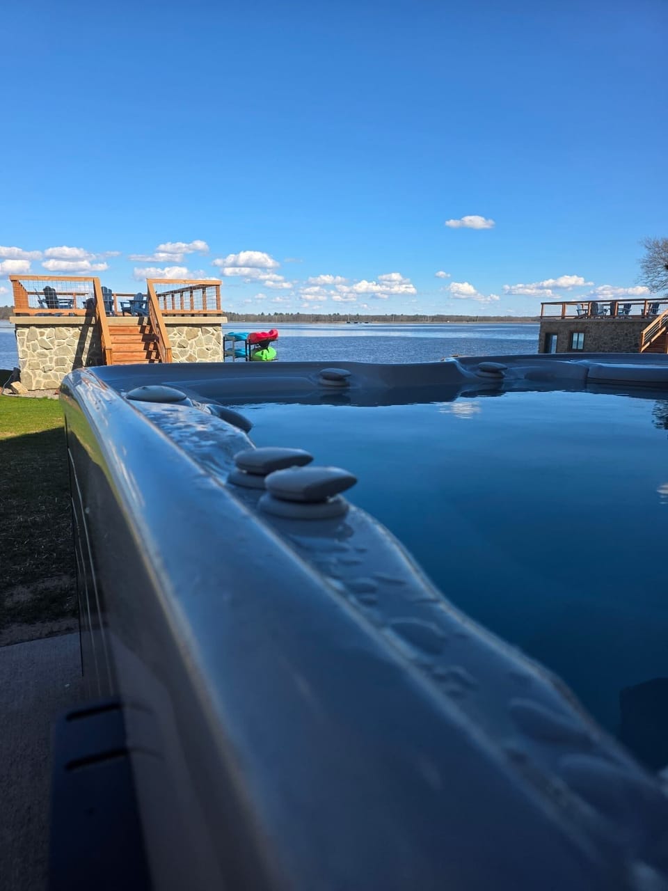 Overlook the lake while soaking in the hot tub.