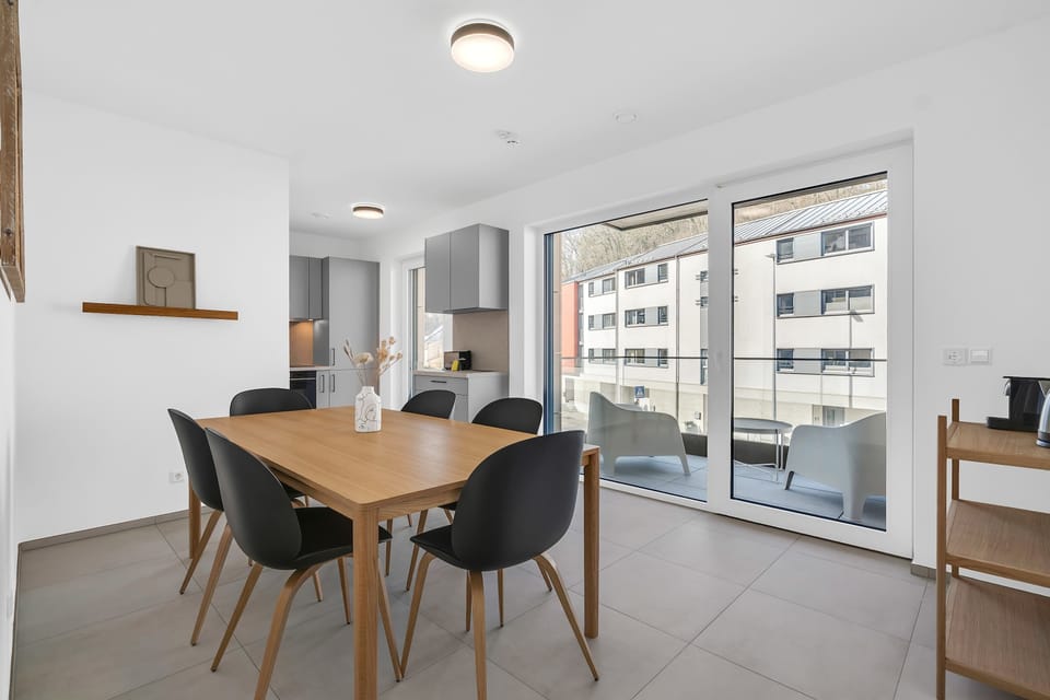 Dining area with balcony access, perfect for meals with natural light and fresh air.