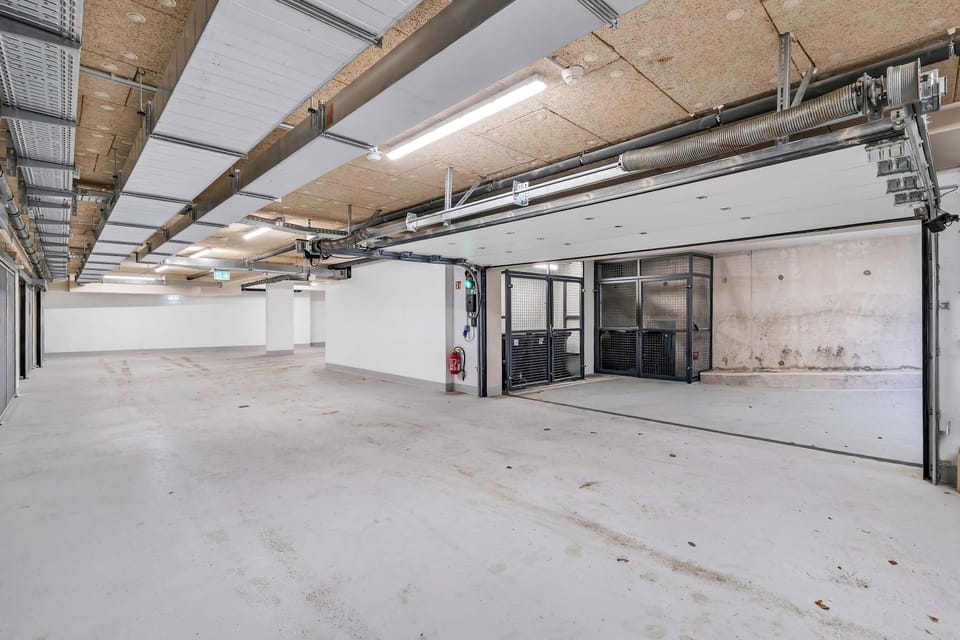 Large garage with direct building access and easy maneuvering.