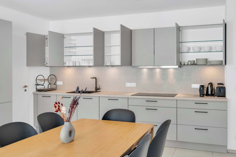 Fully equipped kitchen with modern appliances, generous storage, and everything needed to prepare meals comfortably
