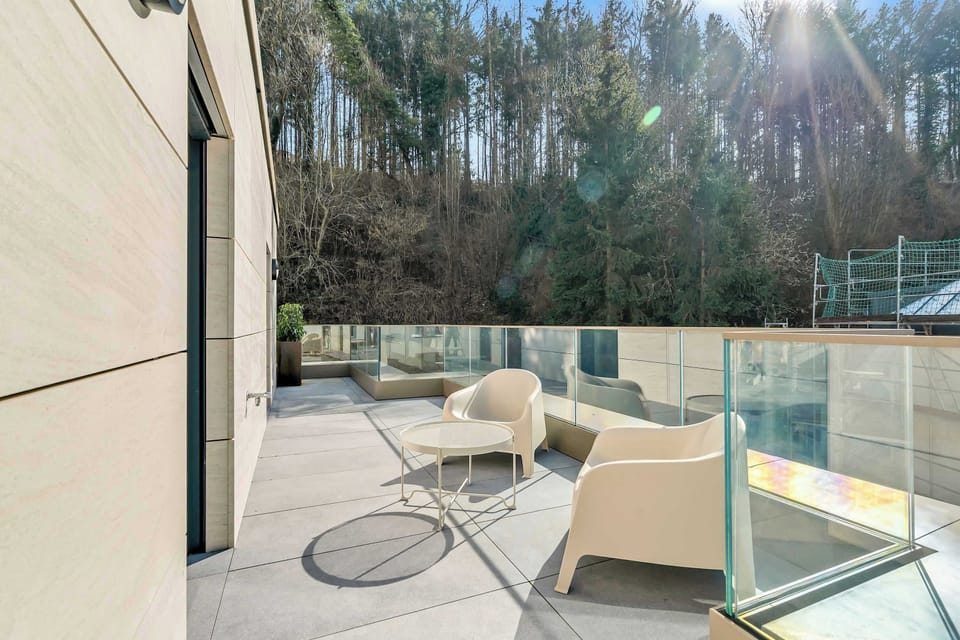 Common outdoor terrace with seating area, fresh air, and peaceful views, ideal for morning coffee or evening relaxation
