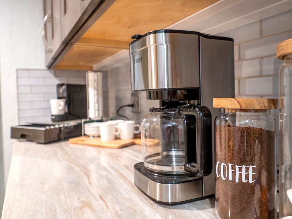 Coffee Corner: Brew your perfect cup in style with modern appliances and chic decor!