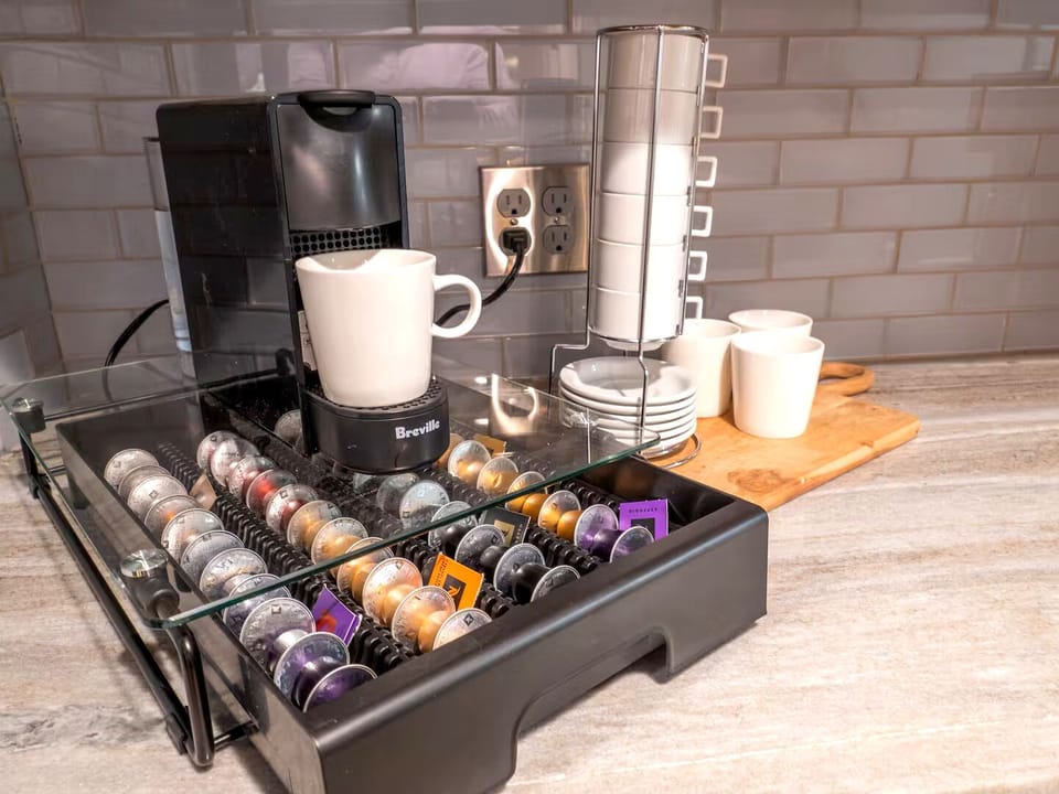 Coffee Corner: Brew your perfect cup with our espresso maker and vibrant pods selection!