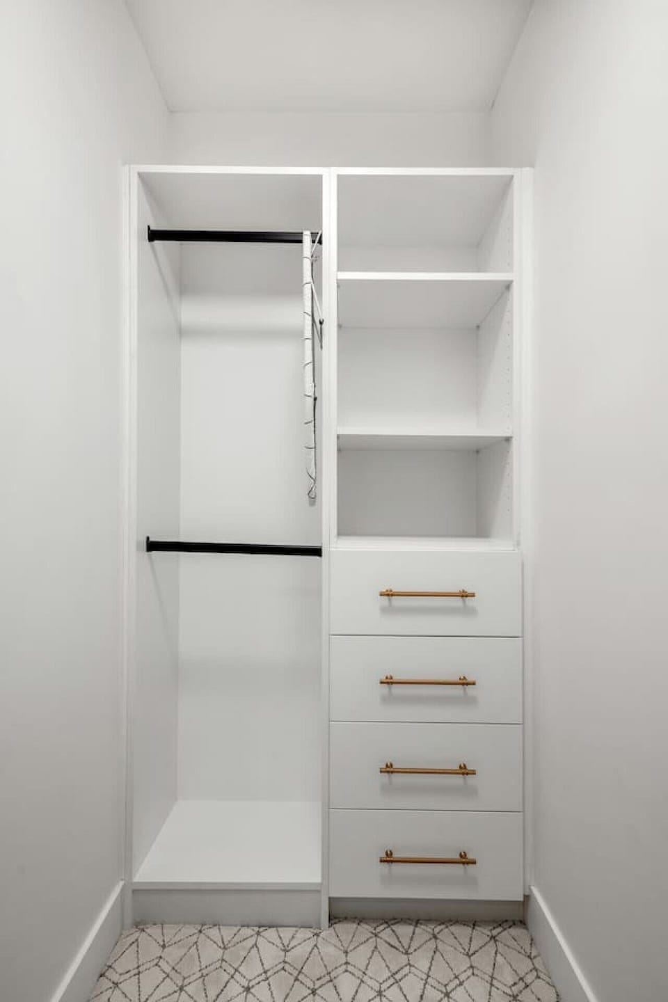Walk-in closet featuring shelves, drawers, and hanging space
