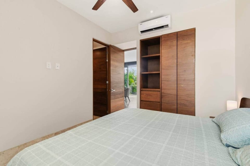 This bedroom also features an en-suite bathroom, A/C, ceiling fan, and room-darkening shades to help you relax and recharge in comfort.