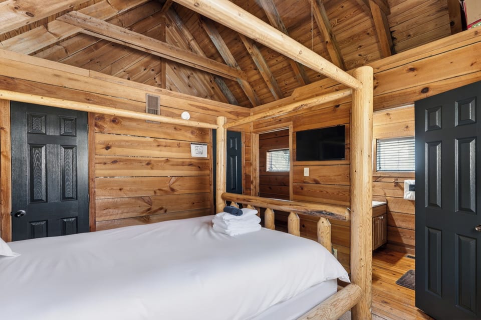 Bedroom 2 features a queen bed, TV and an ensuite bathroom. (Isaiah's Cabin)