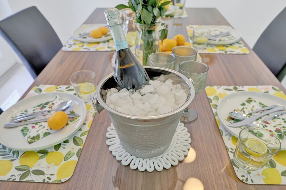Warm dining space featuring a spacious wood table and cozy chairs—perfect for shared meals