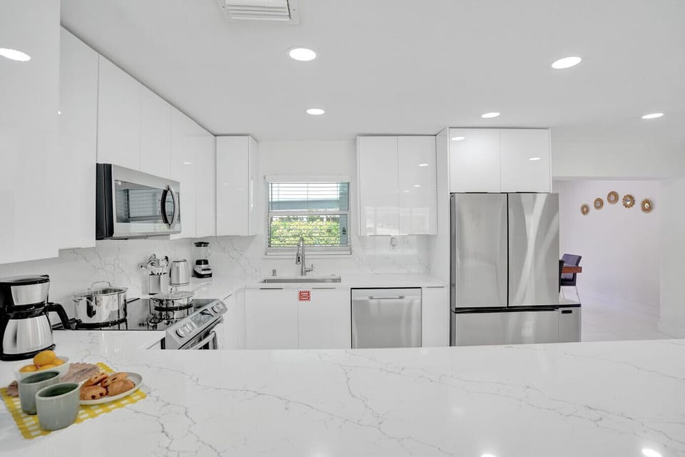 Fully equipped modern kitchen with sleek stainless steel appliances