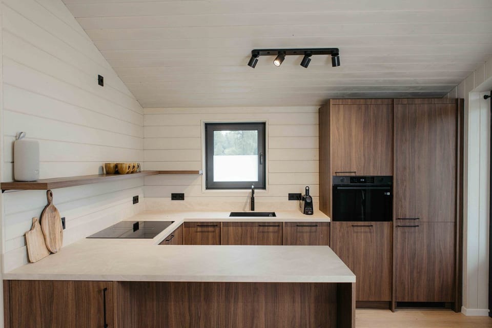Kitchen with dishwasher, oven and microwave.