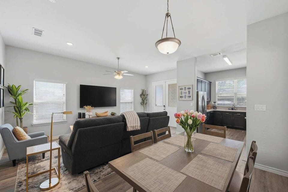 Gather around and eat like you live here. The dining area seats your whole group and flows seamlessly into the full kitchen — ideal for group travel, family stays, and anyone who wants more than a hotel room near Globe Life Field.