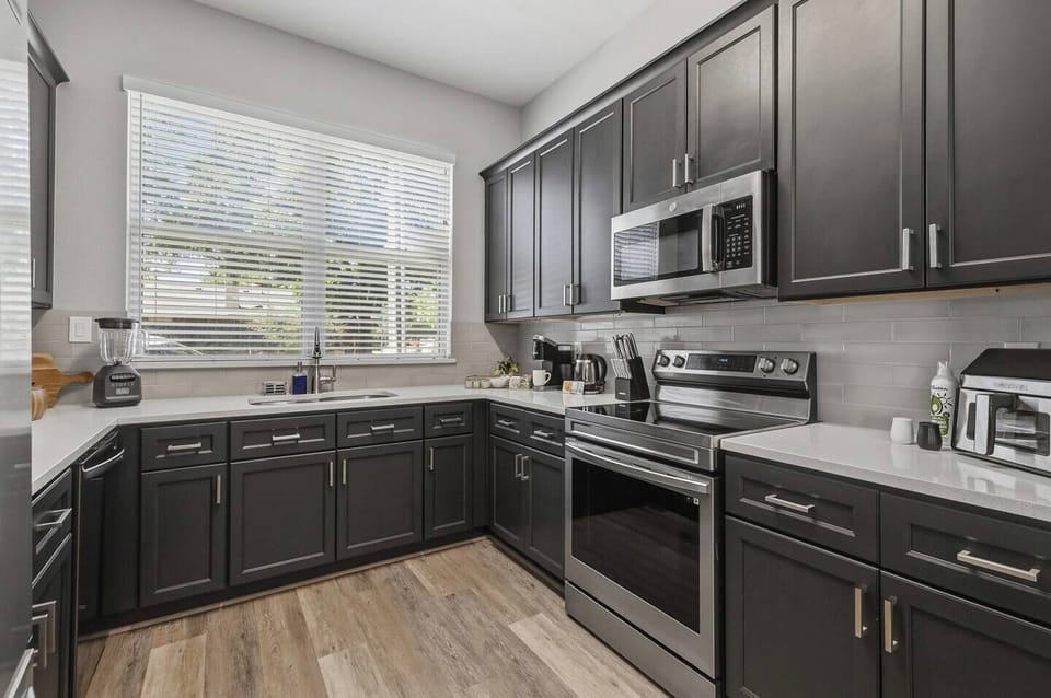 A fully equipped chef's kitchen with everything you need for a home-cooked meal or game day prep. Full-size appliances, cookware, utensils, and counter space to spare — because not every great meal should come from DoorDash.