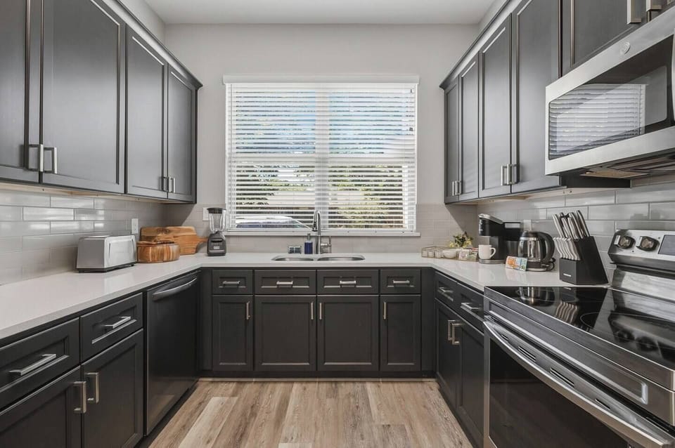 A fully equipped chef's kitchen with everything you need for a home-cooked meal or game day prep. Full-size appliances, cookware, utensils, and counter space to spare — because not every great meal should come from DoorDash.