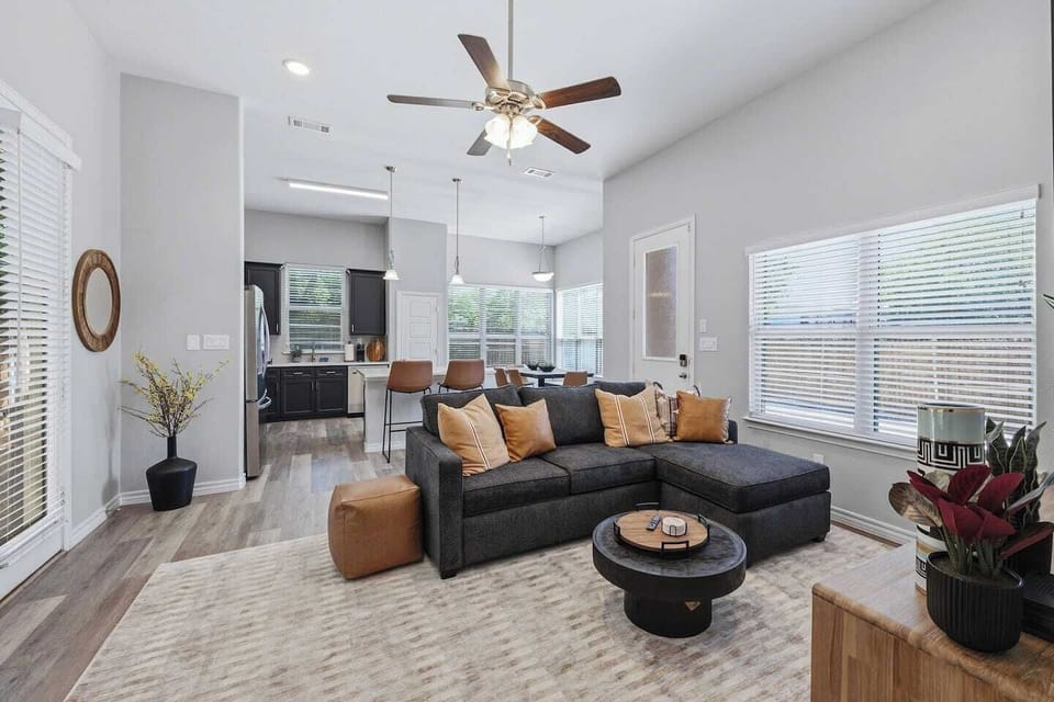 Relax in a stylish open-concept living area perfect for debriefing after a Rangers game, catching highlights on the smart TV, or simply unwinding with your group after a day in Arlington.