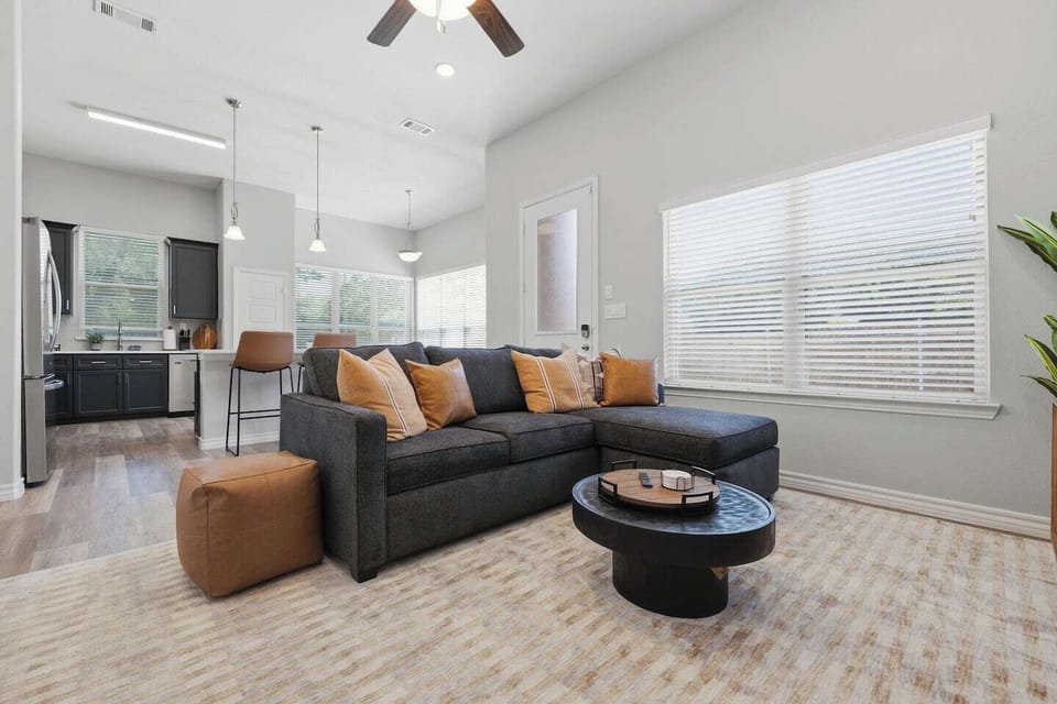 Relax in a stylish open-concept living area perfect for debriefing after a Rangers game, catching highlights on the smart TV, or simply unwinding with your group after a day in Arlington.