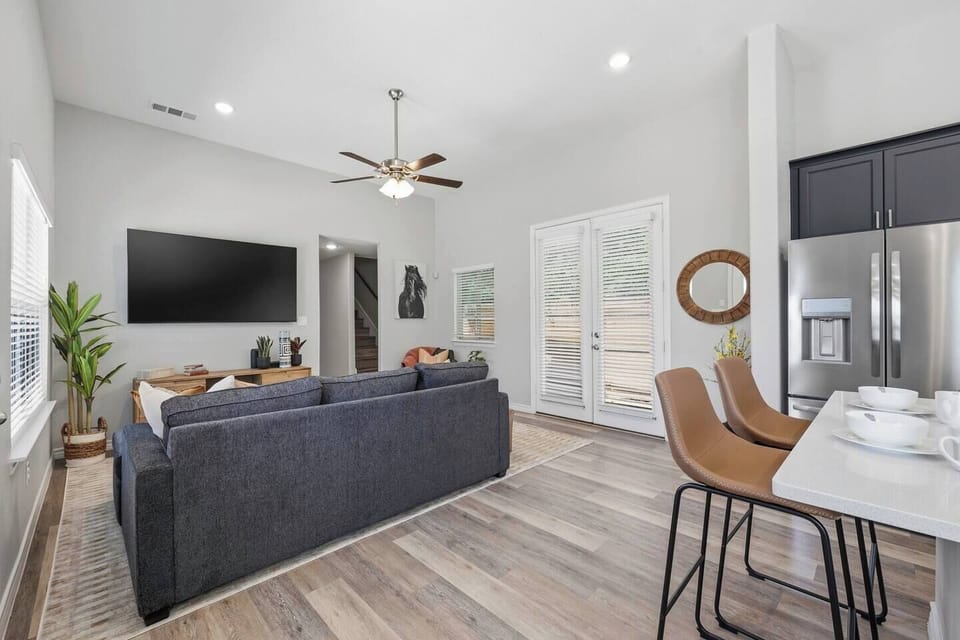 Relax in a stylish open-concept living area perfect for debriefing after a Rangers game, catching highlights on the smart TV, or simply unwinding with your group after a day in Arlington.