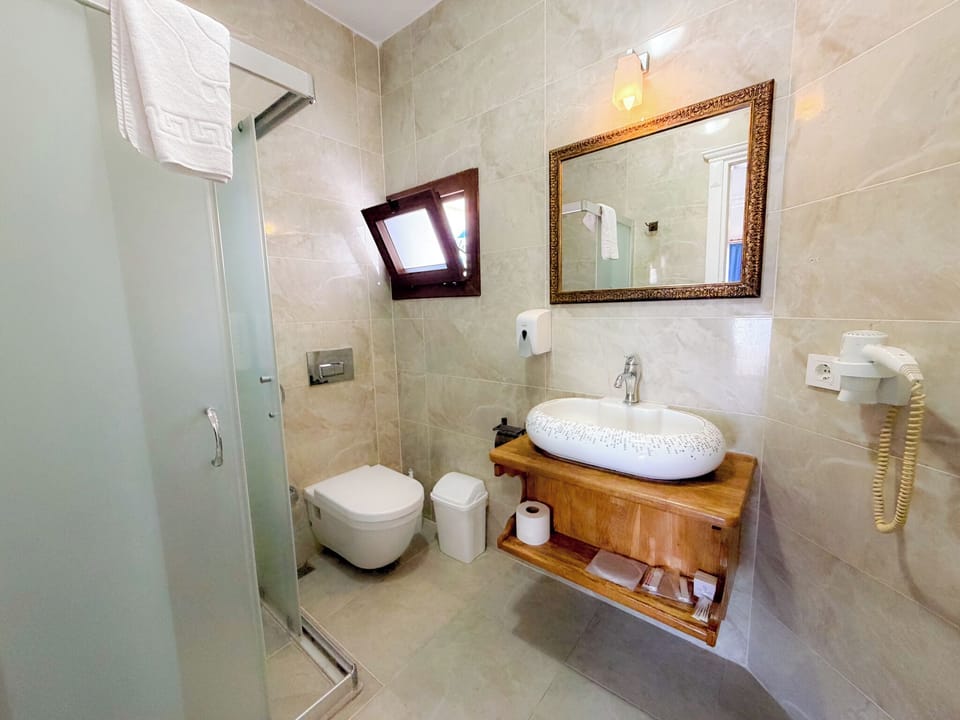 Double Room, Pool View | Bathroom | Shower, hair dryer, towels, soap
