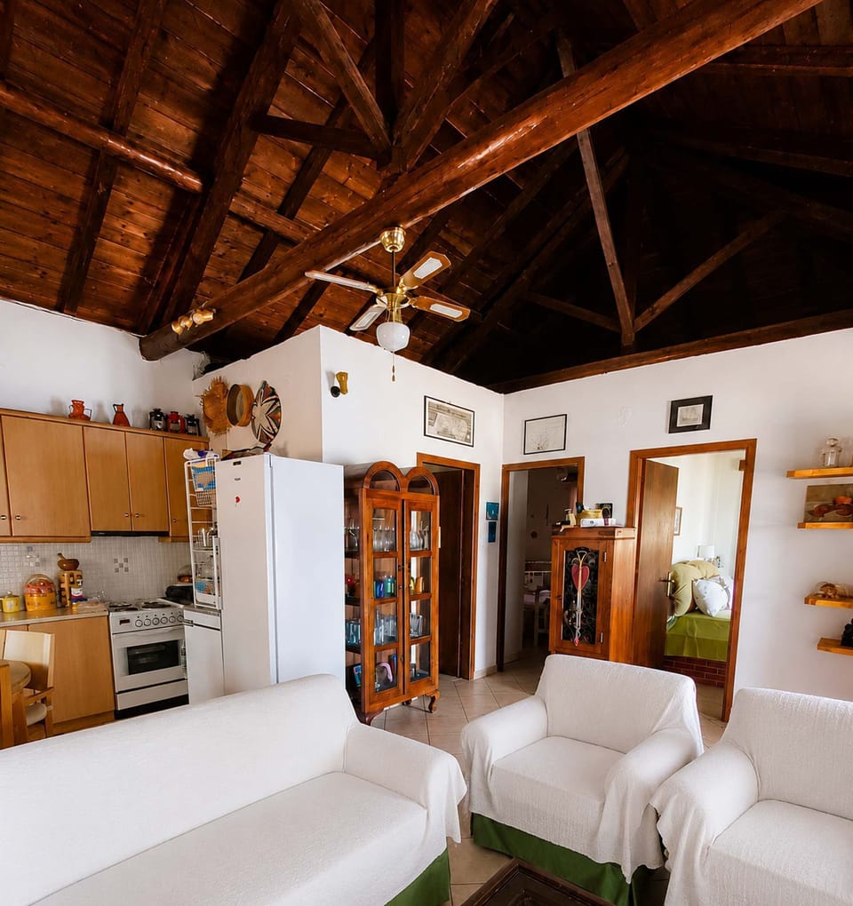 Cozy living area with rustic wooden ceiling