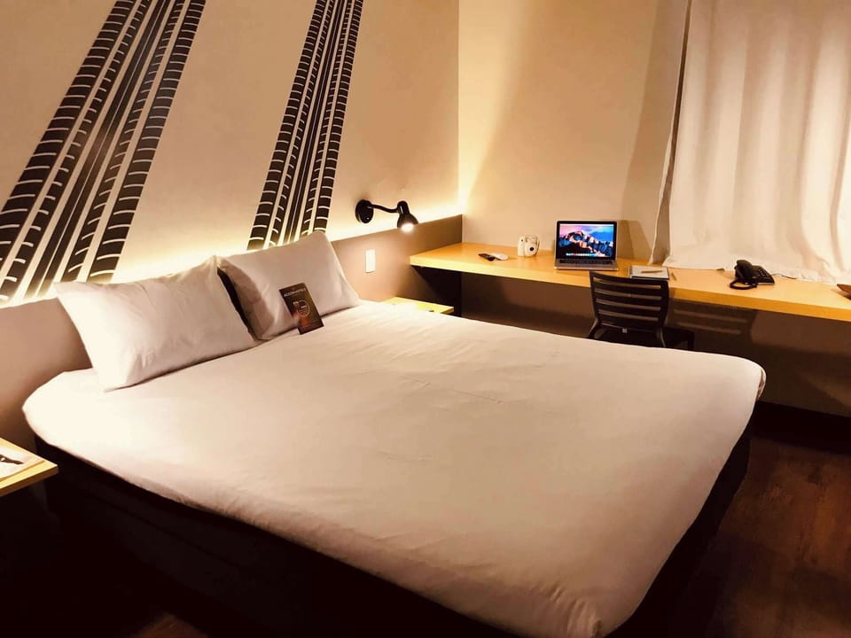 Laptop workspace, blackout drapes, soundproofing, iron/ironing board